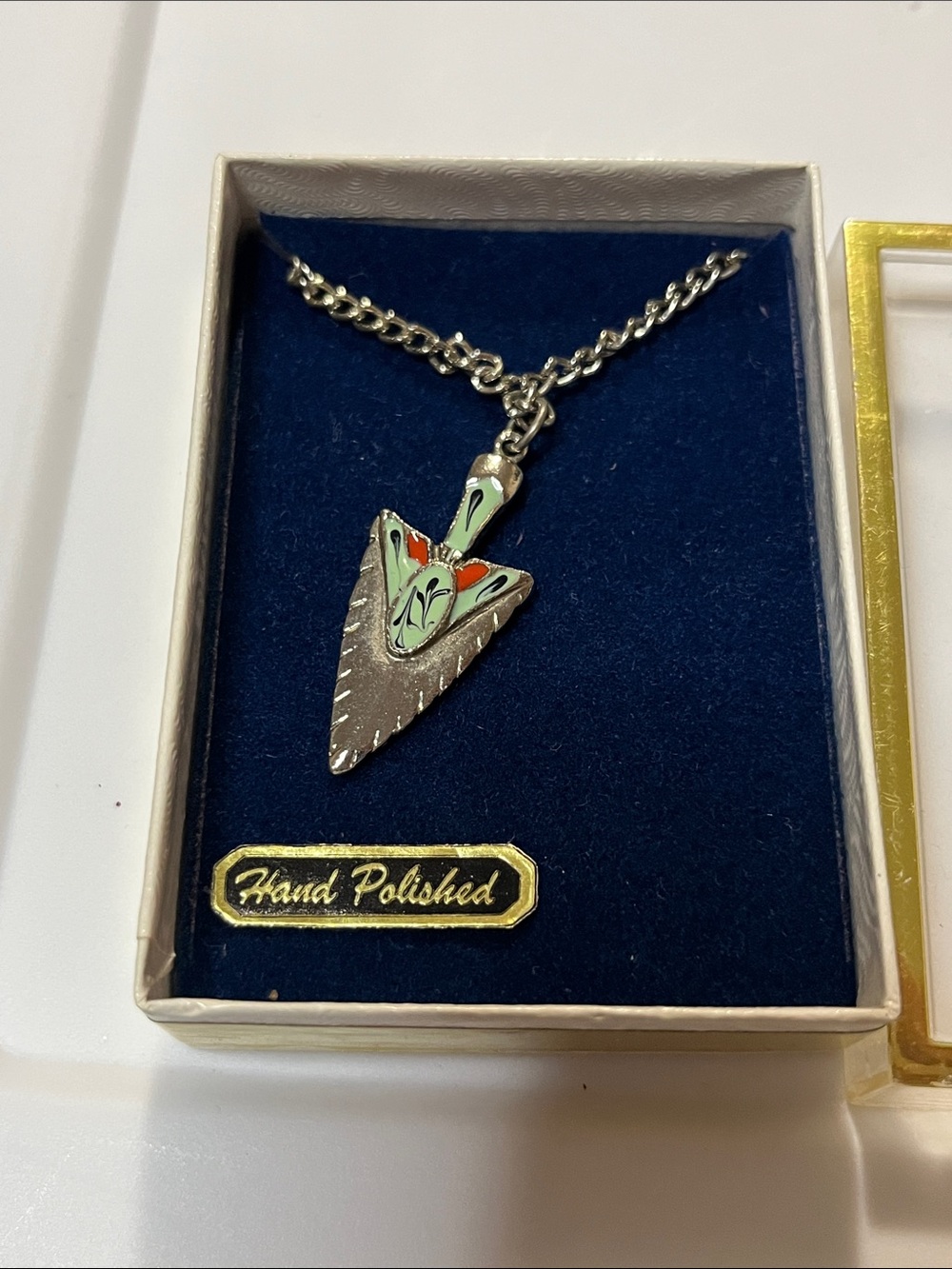 Hand-Polished Silver Arrowhead Pendant Necklace with Green and Orange Enamel